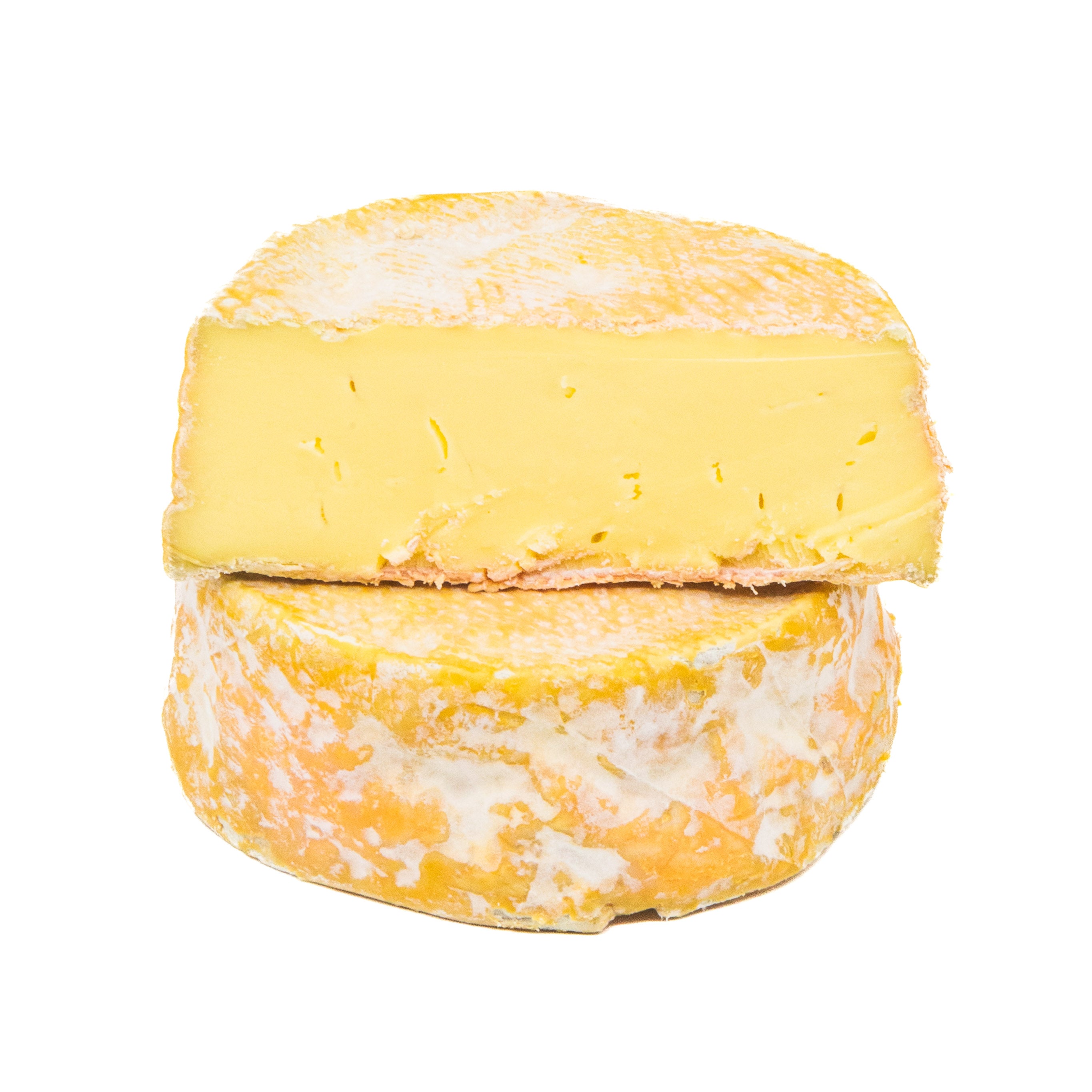 Two wheels of cheese stacked on a white background